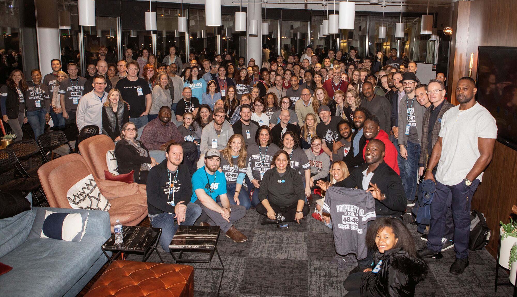 The 48in48 community at an event opening — a community of marketers and technologists