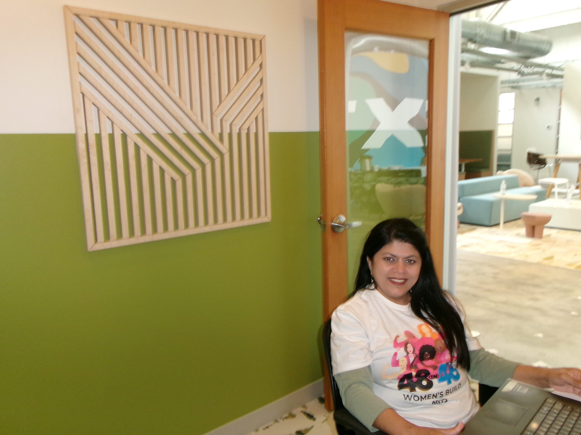 A nonprofit team member working on her website