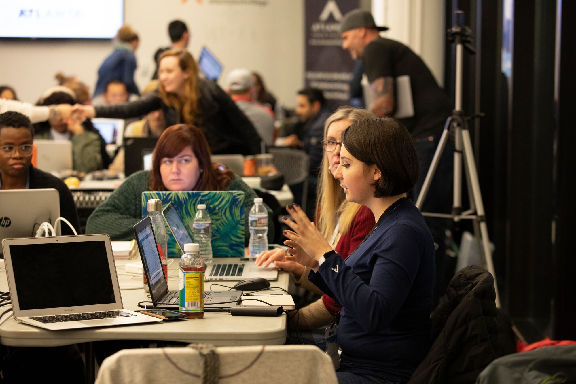Volunteers at laptops working on nonprofit websites