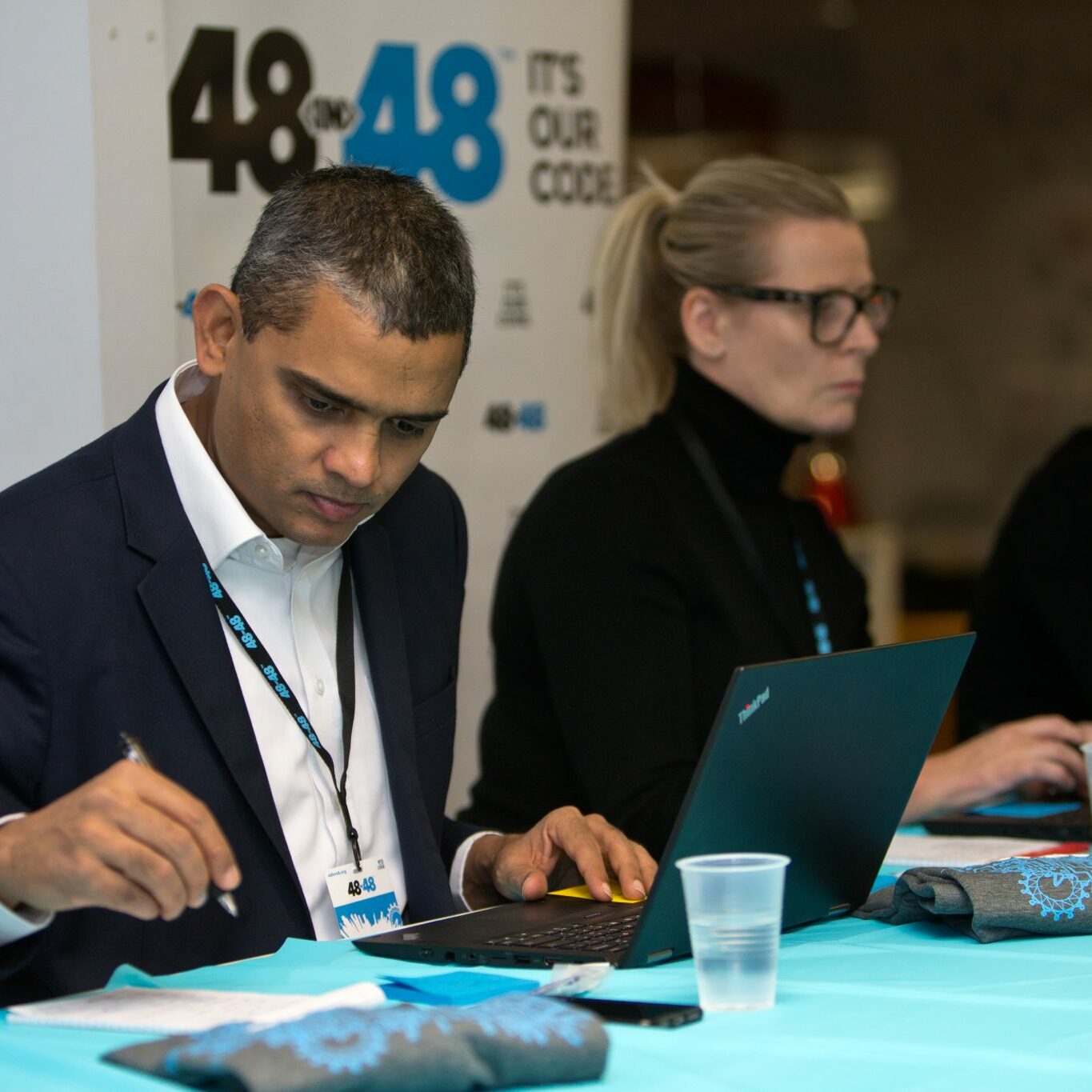 LONDON, UNITED KINGDOM - NOVEMBER 4:  Sumanth Rao (L), serving as a judge on behalf of Delta, pictured with fellow judges Andrea Moore from Red Badger, and Girish Parekh, from Cisco, during the 48in48 event, sponsored by Delta, in London, UK, on November 4, 2018. 48in48 is an event which seeks to help 48 non-profit companies better serve their communities with 48 websites, all in 48 hours, and all with the help of volunteers.